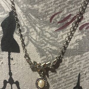 Vintage 1928 pearl bow sterling silver necklace. Sparkles with diamonds bow .
